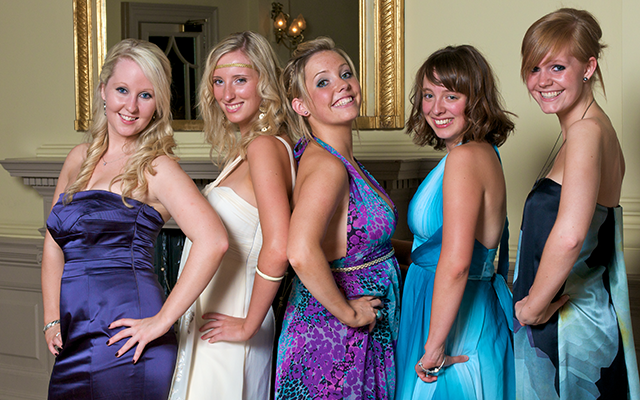 Girls posing at graduation event 